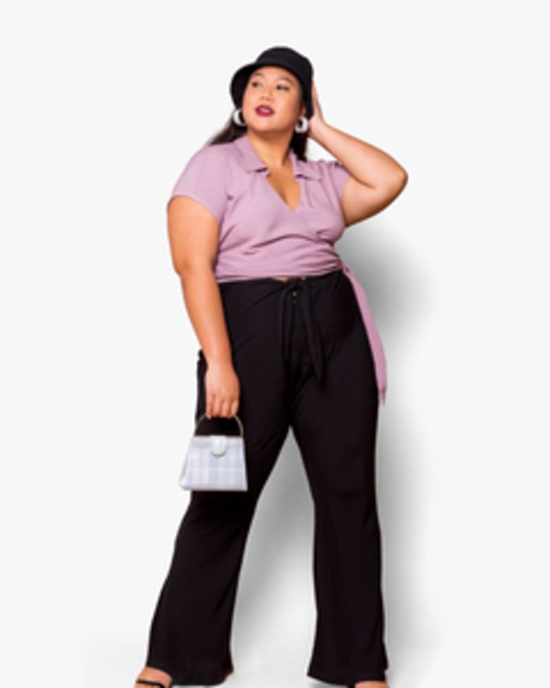 Front of a model wearing a size XL Alyssa Wrap Top in Orchid by Lovefool. | dia_product_style_image_id:249676